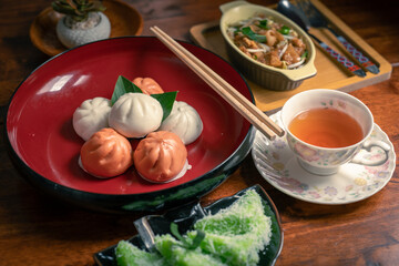 Chinese food on a plate with chopsticks