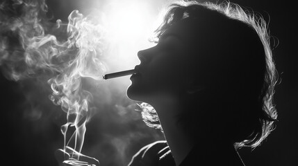 Obraz premium silhouette of a drug addict woman smoking cannabis cigarette