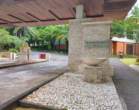 Nusa Dua, Bali, Indonesia - January 18, 2025: The main gate with a tropical trees in Grand Hyatt Bali resort at Nusa Dua, Bali