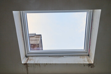 Repair and fixing  etaps of water damage on roof windows in Attic