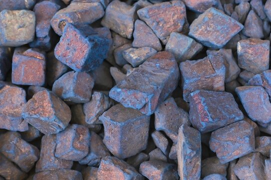 Natural blue nila pure indigo dye stones close up at traditional oriental street souk as background.