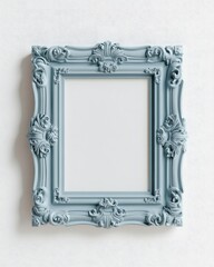 A blue ornate and elegant frame hangs on a white wall