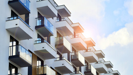 Obraz premium Modern and new apartment building. Multistoried modern, new and stylish living block of flats.