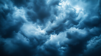 A breathtaking panoramic view of an ominous sky, filled with textured thunderclouds in shades of navy and cobalt. A perfect stock image for backgrounds and marketing materials (1)