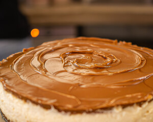 Close-up of vegan cheesecake with caramel in a small pastry shop