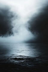 Fototapeta premium Mysterious fog over a still, dark water surface.