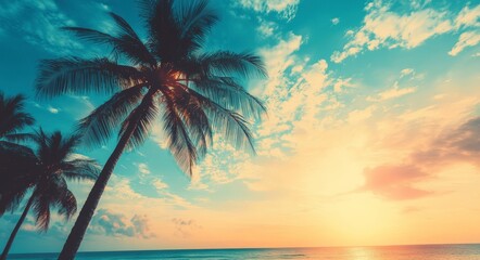 Fototapeta premium Tropical palm trees against bright blue sky