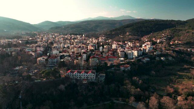 A revealing shot of the city of Edessa while watching the waterfalls