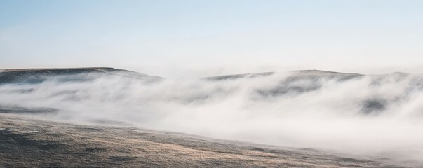 Obraz premium Misty hills landscape with soft blending of clouds and sky