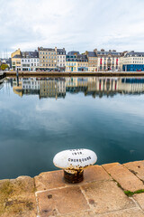 A view across the water of the inner harbor  at Cherbourg, France in autumn