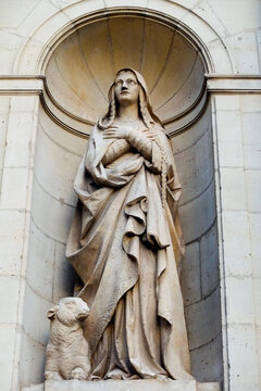 Paris, France. Europe  Statue of Mary with a lamb at her side.