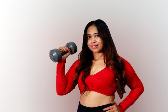 Asian Happy woman work out with dumble isolated on white background.