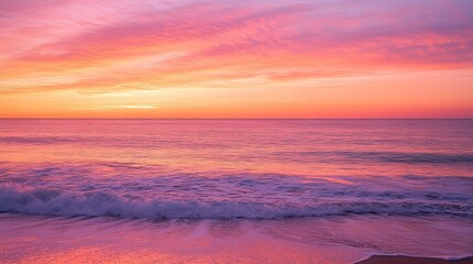 Caribbean sunset with orange and pink hues, calm waves, and a clean horizon, evoking serenity and natural beauty.
