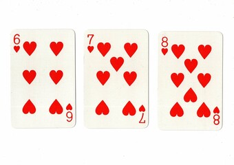 A hand of playing cards showing a run of three on a white background.