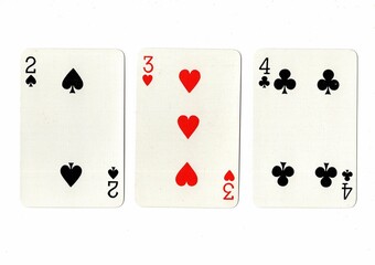 A hand of playing cards showing a run of three on a white background.