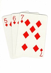A hand of playing cards showing a run of three on a white background.