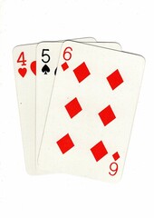 A hand of playing cards showing a run of three on a white background.