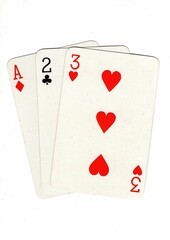 A hand of playing cards showing a run of three on a white background.