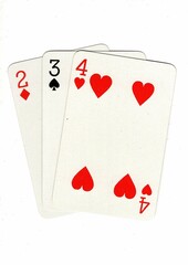 A hand of playing cards showing a run of three on a white background.