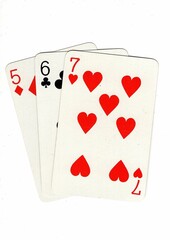 A hand of playing cards showing a run of three on a white background.