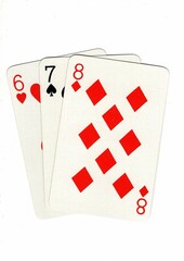 A hand of playing cards showing a run of three on a white background.