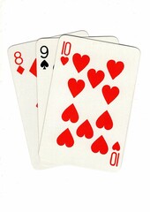 A hand of playing cards showing a run of three on a white background.