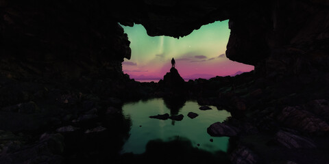 Silhouette of Person in Cave Watching Aurora Borealis Over Water Reflection
