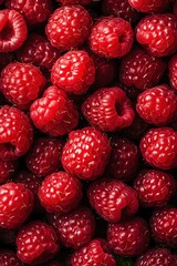 Closeup of fresh raspberries, bright red and textured, filling the entire frame