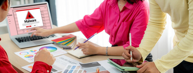 Cyber attacking concept. Malware alert showing on computer screen display scam and threat detection on computer system or online server to be removed brisk.