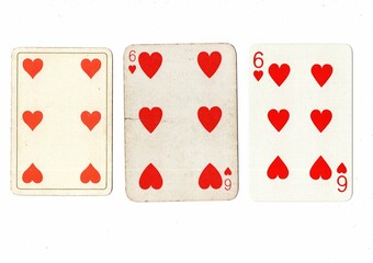 Vintage playing cards in three different designs showing the same value.