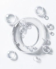 Bubbles floating above a circular clear glass shape on a white background