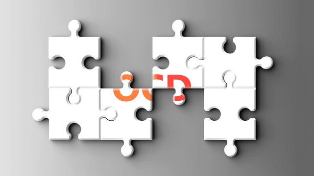 Ocd as a complex topic - pictured as word ocd on a puzzle pieces to show that ocd is a composite subject. Solving a puzzle. Pieces coming together to make a whole