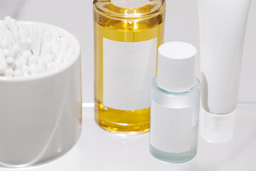 Beauty products for facial skin care on marble background. Serum, moisturizing cream and toner. Mockup.