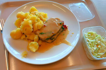 Dinner: potatoes with meat.