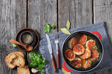 turkey potato cakes in a red pot, top view