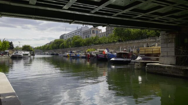 Houseboats Moored Along a River in Paris