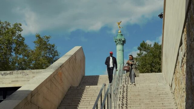 People on Staircase Near Bastille Column in Paris
