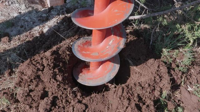 Close Up of Dirt Auger Bit Digging