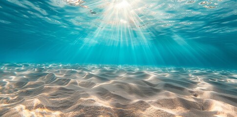 Underwater ocean landscape with sunlight falling through the surface. Empty blue sea summer background. 