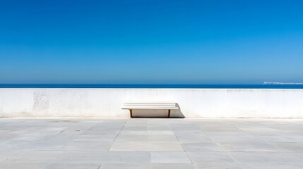 Minimalist coastal view featuring an empty bench overlooking a calm ocean under a clear blue sky : Generative AI