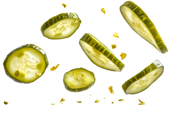 Isolated falling pickled cucumber slices captured on a clean white surface.