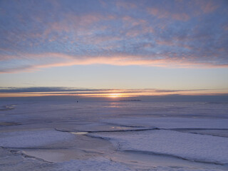 Ice breaks up in the Gulf of Finland in the Baltic Sea: March, sunset.