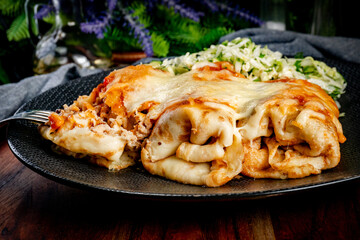 Stuffed pancake baked with cheese.