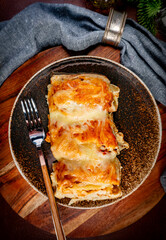 Stuffed pancake baked with cheese.