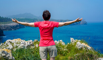 Woman enjoying the cliff views