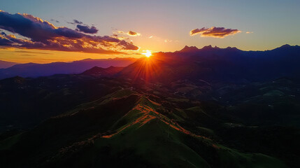 Breathtaking sunset over mountain range with warm glowing hues