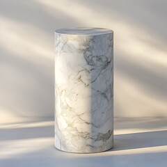 A cylindrical marble pedestal stands against a plain background