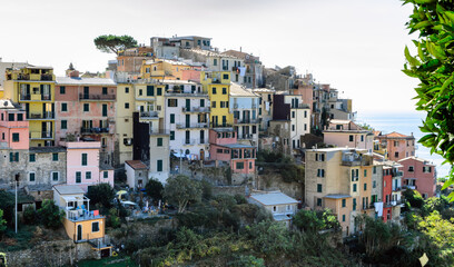 Obraz premium Panoramic view of the village of Corniglia, one of the five ancient villages of Cinque Terre, located on rugged northwest coast of Italian Riviera, Liguria. Well-known tourist location