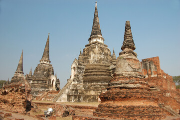 Fototapeta premium Ancient temple ruins of Wat Phra Si Sampet in Ayutthaya, Thailand, showcasing Khmer-style architecture, historic stupas, and rich cultural heritage