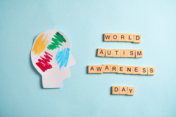 World autism awareness day concept, with symbol craft. Colorful painted head silhouette